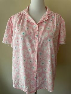 "Vintage 80s pink button up shirt, lace embroidered collar and sleeves. Made by Diamond Hill, marked size 42. Polyester cotton blend. Pink with white floral pattern, teal, purple and dark pink accents.  Please ask questions!  Measurements (laid flat):  Tag Size: 42 Length: 23\" Pit to Pit: 24\"x2 Waist: 25\"x2 Condition: Good vintage condition, no issues noted.  The vintage pieces I sell have all led a previous life and may tell their stories through minor imperfections. I'll do my best to indicate overall condition, but please refer to the pictures. Your purchase continues the life of this garment...what stories will you tell while wearing it?  Please note there may be a slight difference in color when comparing the actual garment to the monitor image. (0466)" Feminine Floral Print Shirt For Daywear, Pink Floral Print Shirt For Daywear, Pink Lace Trim Blouse, Pink Floral Print Button-up Shirt, Pink Floral Print Collared Blouse, Feminine Pink Floral Print Shirt, Pink Collared Shirt For Daywear, Feminine Pink Collared Top, Pink Peter Pan Collar Top For Spring