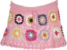 a pink crocheted skirt with multicolored flowers on the front and bottom