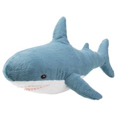 a stuffed shark is shown on a white background