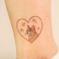 a small tattoo on the ankle of a cat