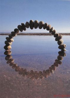 a circle made out of rocks in the water