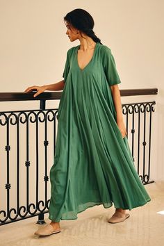 Sap green maxi dress crafted from soft mul cotton. - Aza Fashions Cotton Maxi Dress For Daywear, Flowy Cotton V-neck Midi Dress, Relaxed Fit Maxi Dress For Daywear, Green Flowy Long Dress, Flowy Green Long Dress, Relaxed Fit Green Summer Dress, Green Cotton V-neck Dress, Green Long Maxi Dress For Daywear, Casual Cotton Floor-length Maxi Dress