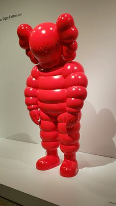 an inflatable red bear is on display at the museum