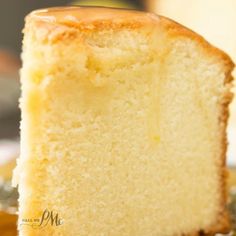 a close up of a piece of cake on a plate with saucer in the background