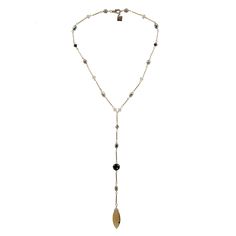 This versatile necklace features an authentic vintage Conta Di Ojo bead from Cape Verde, known for its protective properties and believed to attract good luck and positive energy. Accentuated with Austrian crystals and real pearls, the design adds sophistication and sparkle. Handmade in the U.S. with precision, the necklace is finished with a silver-plated chain for timeless elegance. Perfect for adding cultural significance and style to any outfit, this necklace blends tradition with modern all Elegant Adjustable Beaded Necklaces, Elegant Adjustable Beaded Necklace, Elegant Beaded Necklaces With Teardrop Natural Stones, Elegant Teardrop Beaded Necklaces With Natural Stones, Elegant Drop Necklace With Gemstone Beads, Elegant Teardrop Beaded Necklace With Natural Stones, Elegant Silver Drop Necklace With Natural Stones, Adjustable Lariat Jewelry With Gemstone Beads, Elegant Beaded Chain Lariat Crystal Necklace