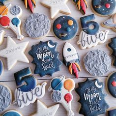 decorated cookies with the words to the moon and back written on them