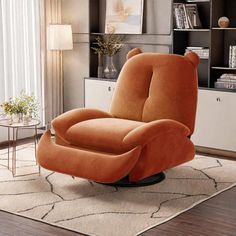 an orange recliner chair sitting on top of a rug