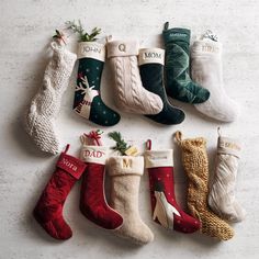 christmas stockings are arranged in rows on a white surface