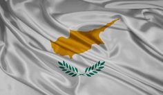 the flag of cyprus waving in the wind with an olive branch on it's left side