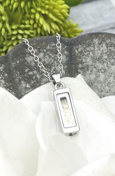 This listing is for ONE cremation necklace. Please choose the style from the dropdown menu. This is such a wonderful keepsake to commemorate any loved one or beloved pet. These pendants are made from stainless steel so they are considered hypoallergenic and will not tarnish. These pendants come on a durable stainless steel chain. Bar/Rectangle pendant measures approximately 16x6mm Round pendant measures approximately 1/2" Heart pendant measures approximately 1/2" Teardrop pendant measures approximately 1/2" tall These pendants/urns can be filled with human or pet cremation ashes, sand, fur, hair, glitter, small flower petals, etc. These are made with glass so anything you put inside of them will be visible. These are to be filled at home by the customer. It is not recommended to get these Jewelry For Ashes, Cremation Bracelet, Memorial Jewelry Ashes, Dried Flower Jewelry, Locket Ring, Cremation Necklaces, Pet Cremation, Urn Pendant, Urn Jewelry