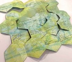 several pieces of paper with writing on them are arranged in the shape of a star