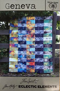 a book with an image of a blue and yellow quilt