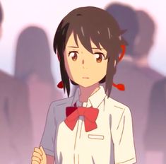 an anime character wearing a white shirt and red bow tie standing in front of a group of people