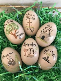 four eggs with hand painted names on them