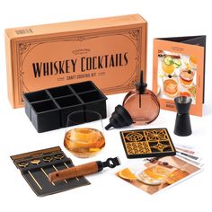 the whisky cocktail kit includes an orange box, two glasses and several other items to make it