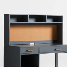 an office desk with a corkboard on the top and two drawers below, against a white background