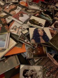 a pile of various records and cds on top of each other