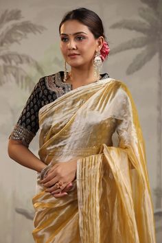 Go for this beautiful yellow tissue silk saree at parties and festive occasions. The saree comes with a black embroidered saree blouse. Shop designer saree online in USA from Pure Elegance. Disclaimer: The actual product may vary slightly from the image. These are custom orders, hence expect slight variation in color, placement of the motif or buta. ESTIMATED DELIVERYBecause this is a custom order, it would take about 4 weeks from the date of purchase. RETURN POLICYThis product is a custom order Embroidered Saree Blouse, Indian Dresses Anarkali, Dresses Anarkali, Tissue Silk Saree, Suits Indian, Sharara Suits, Embroidered Saree, Pure Elegance, Fashion Journals