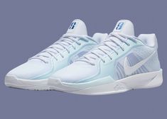 the nike air zoom low in white and light blue is on sale for $ 99