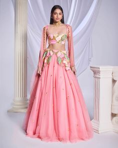 Our pink tulle lehenga is adorned with intricate patchwork embroidery and metallic accents cascading from the waist to the hips. The lehenga is embellished with scatter embroidery, featuring gold elements and delicate pink crystals throughout. Completing the ensemble is a sleeveless pink blouse featuring matching patchwork.From Papa Don’t Preach’s Bring Your Own Fairytale collection. DELIVERY TIMEPlease allow 8-12 weeks for your outfit to arrive. FABRIC DETAILSTulle Professional cleaning only. Pink Hand Embellished Organza Anarkali Set, Pink Embellished Organza Dupatta, Designer Hand Embellished Pink Anarkali Set, Pink Hand Embellished Dupatta For Diwali, Traditional Pink Hand Embellished Sharara, Hand Embellished Pink Dupatta For Diwali, Fitted Pink Anarkali Set Hand Embellished, Pink Hand Embellished Organza Lehenga, Pink Hand Embellished Floor-length Anarkali Set