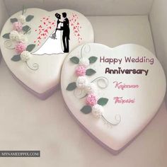 two heart shaped cakes in a box with the words happy wedding anniversary written on them