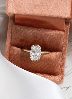 an engagement ring in a velvet box