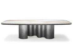 an oval marble dining table with four circular metal bases and white marble top, viewed from the front