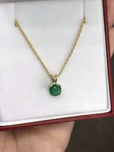 Featured here is a stunning, round natural emerald pendant in fine 14k yellow gold. Displayed in the center is a dark-green emerald accented by a simple four-prong gold mount, allowing for the emerald to be shown in full view. The earth mined, green Colombian emerald has a desirable lush green color. This emerald is 100% earth mined and is not perfect! Gorgeous minor flaws are present within the stone, embrace uniqueness! Chain not included with emerald pendant. Total Carat Weight: 0.90cts Setti Wedding Accessories Jewelry, Colombian Emeralds, Emerald Engagement, Emerald Pendant, Emerald Necklace, Solitaire Pendant, Emerald Engagement Ring, Emerald Jewelry, Emerald Cut Diamonds