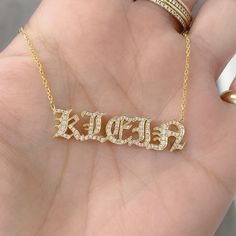 This unique personalized Old English font nameplate cut-out necklace is composed of 14K solid gold and beautifully pavé set with genuine GVs1 quality natural real Diamonds. This pendant is complemented by a durable 14K solid gold adjustable chain or can be purchased as a charm alone without the chain under the "Length" drop-down menu. NOTE: The item will be made in the exact casing of the characters entered. Please be mindful of this detail when providing the customization desired. Name Dimensio Gold Initial Pendant Name Necklace With Diamond Accents, Customized 14k White Gold Necklace, Luxury Customizable Nameplate Necklaces, Customized White Diamond Jewelry, Customized Yellow Gold Luxury Necklace, Luxury Customized Yellow Gold Necklaces, Customized Luxury Yellow Gold Necklaces, Luxury Gold Name Necklace With Custom Name, White Diamond Nameplate Jewelry