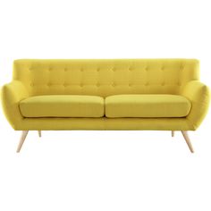 a yellow couch sitting on top of a white floor