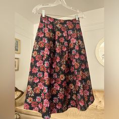 Stunning 70s Style Midi Skirt Brand New With Tag!!! Stretchy Thick Material With A Hidden Side Zipper! Amazing Quality And Detail Approximate Measurements When Laying Flat Are As Follows (Unstretched): Length - 12” Waist - 26” Pink A-line Bottoms For Party, Pink Floral Print Maxi Skirt For Party, Pink A-line Party Bottoms, Floral Print Full Maxi Skirt For Party, Floral Print Full Skirt For Party, Pink A-line Maxi Skirt For Party, Floral Print Flared Skirt For Party, Style Midi Skirt, Floral Midi Skirt