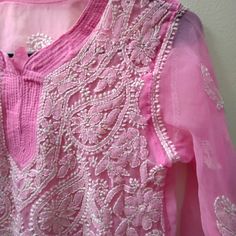 Beautiful Pink Hand Embroidered Sheer Top In Size Medium. Embroidery Done On The Full Front And Hem Of The Sleeves. Never Worn Without Any Brand And Size Tag. Cheap Resham Embroidery Blouse Piece For Eid, Embroidered Pink Top For Eid, Pink Embroidered Top For Eid, Festive Pink Tops With Chikankari Embroidery, Pink Floral Embroidered Tops For Eid, Summer Chikankari Embroidery Fabric, Summer Chikankari Embroidered Fabric, Traditional Pink Embroidered Summer Fabric, Traditional Pink Embroidered Fabric For Summer