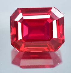 a large red diamond sitting on top of a table