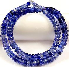 "Gemstone ---- blue sapphire shape ---- rondelle width ---- 5-8 mm length ---- 16 inch long strand texture .... faceted color .... blue quality .... aaa++ color sparkling blue shaded hole size 0.7 mm beautiful 16\" strand natural shaded blue sapphire beads this natural blue sapphire beads are very rare and extremely beautiful they have clear and clean body they look beautiful on neck high quality beads 100% satisfaction guaranteed wholesale shop // wholesale price" Sapphire Beads, Blue Sapphire Gemstone, Gemstone Beads Jewelry, Clean Body, Jewelry Beads, Natural Shades, Natural Blue Sapphire, Sapphire Blue, Sapphire Gemstone