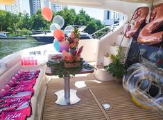 a boat with balloons and decorations on the deck