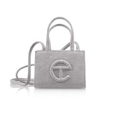 Brand New In Bag Our Iconic Unisex Telfar Bag Made In Collaboration With Ugg In Heather Grey Fleece. Bag Features Double Strap To Be Worn Cross-Body, Inlaid Shearling Telfar Logo, 100% Cotton Lining And Magnetic Snap Closure. Small Is The Party-Bag + The Afterparty Too. (4 3/4" Height, 6 5/8" Width, 3 1/8" Depth, 21" Drop) Materials: Outer: 65% Cotton, 35% Polyester Fleece Bag, Telfar Logo, Telfar Bags, Ugg Bag, The Afterparty, Telfar Bag, Grey Bag, Girly Bags, Celine Luggage