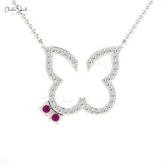 Description If she is a jewelry lover, then Ruby and diamond Open Butter Fly Necklace or you can say gemstone jewelry with sparkling white diamonds is the best gift to give her some. Assembled in 14k solid gold finish with a total metal weight of 3.26 grams. This Round -shaped Ruby with excellent cuts and transparency is twirling well with a dazzling 1.20mm pave-set diamonds. Product Details SKU CJ-N-1432-R Metal 14K Solid Gold Chain type Cable Chain Chain length 16 inch Closing mechanism Spring Elegant Butterfly Birthstone Necklaces, Elegant Butterfly Birthstone Jewelry, Elegant Butterfly Necklace For Anniversary And Mother's Day, Diamond Butterfly Necklace For Anniversary, Butterfly Diamond Necklace For Anniversary, Diamond Necklace With Butterfly Charm For Anniversary, White Gold Butterfly Pendant Necklace For Anniversary, Anniversary Diamond Necklace With Butterfly Shape, Anniversary White Gold Butterfly Pendant Necklace