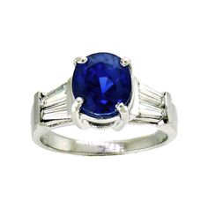 The sapphire in this vintage-style platinum mounting is the most incredible blue. The mixed cut oval is a strongly saturated, violetish blue with a medium dark tone, and moderately included clarity. It's easy to get lost in the deep blue sparkle set off by two tapered baguette diamonds on each side. The platinum mounting is a very sturdy, yet still elegant rendition of the 1940s style. It will stack beautifully with a curved baguette band, or be just as lovely on its own. It's also a nice choice Classic Oval Sapphire Ring With Polished Finish, Luxury Oval Sapphire Ring With Polished Finish, Classic Blue Sapphire Ring With Oval Cabochon, Classic Oval Sapphire Gemstone Ring, Classic Polished Lab-created Sapphire Ring, Classic Blue Sapphire Ring With Baguette Cut, Classic Baguette Cut Sapphire Ring With Polished Finish, Luxury Oval Lab-created Sapphire Ring, Timeless Blue Oval Sapphire Ring