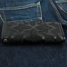 Tribal Cross Black Genuine Stingray Leather Trifold Biker Wallet  Genuine black stingray skin and genuine leather   Tri-fold wallet design  925 Sterling Silver Skull Snap and Grommet for Wallet Chain  Internal layout: 2 Bill Slots, 1 Long Zip Slot and 14 Credit Card Slots  Wallet measures (closed): 3 3/4" x 7 1/2"  Wallet measures (fully opened): 10 1/2" x 7 1/2"   With its masculine edge, our Tribal Cross Black Genuine Stingray Leather Trifold Biker Wallet is truly magnificent. We use the fines Wallet Chains, Wallet Design, Biker Wallet, Belt Accessories, Fold Wallet, Wallet Chain, Trifold Wallet, Tri Fold, Stingray