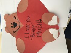 a paper cut out of a teddy bear with the words i love you on it