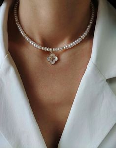 Adorn yourself with the delicate charm of our dainty pearl necklace with a mother of pearl clover pendant - a perfect gift for the woman who deserves nothing but the best. Meticulously handcrafted with precision, our real freshwater pearl necklace showcases the artistry and attention to detail that makes it unique. Four leaves clover mother of pearl pendant radiates an iridescent glow that captures the essence of elegance and sophistication Embrace luck, love, hope, and faith with the symbolism Heart-shaped Pearl Pendant Jewelry Gift, Heart-shaped Pearl Pendant Jewelry For Gift, Elegant Heart-shaped Pearl Pendant Jewelry, Luxury Heart-shaped Pearl Pendant Necklace, Mother Of Pearl Clover Necklace, Four Leaves Clover, Dainty Women, Dainty Pearl Necklace, Clover Jewelry