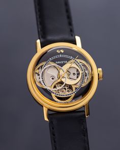 Our exclusive Raketa Skeleton customized handcrafted watch is a stunning display of  craftsmanship and attention to detail. It features an open skeleton design, revealing the intricate workings of the movement underneath. The exposed mechanism is meticulously finished with golden gears and components, creating a beautiful contrast against the steel case and surrounding elements. This exquisite vintage skeleton wristwatch is a remarkable showcase of intricate craftsmanship and timeless design. Th Skeleton Dial Watch With Round Dial For Gift, Classic Skeleton Dial Watch As A Gift, Classic Skeleton Dial Watch Accessories As Gift, Skeleton Dial Watch Accessories As Gift, Skeleton Dial Jewelry Gift With Round Dial, Timeless Gold Jewelry And Watches With Skeleton Dial, Classic Watches With Rotating Bezel For Gift, Luxury Skeleton Dial Watches As Gifts, Classic Watches With Rotating Bezel As Gift