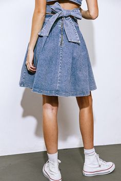 An elegant, art-inspired denim mini skirt with a full, pleated design and a back zipper closure.Details:Self : 57% Cotton 32% Polyester 1% SpandexSize & Fit- Model is 5`8" And Wearing Size Small- Measurements Taken From Size Small- Approx. Length: 21" Skirt With Pleats, Elegant Art, Denim Midi Skirt, Resort Collection, Washed Denim, Swim Accessories, Denim Mini, Swimsuit Cover