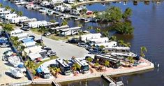 an aerial view of a marina with boats and rv parks