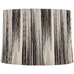 a lamp shade with black and white stripes on it