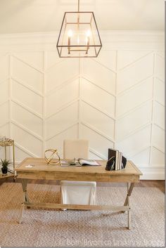 an image of a room with white walls and a wooden table in the middle, on instagram