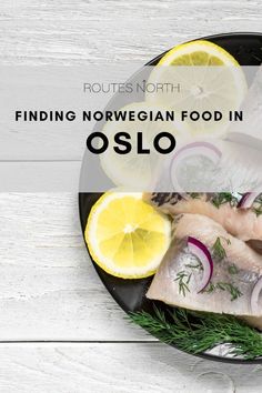 fish and lemons on a plate with the words finding norwegian food in oslo