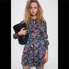 Floral Dress With Metallic Thread Chic Purple Floral Dress, Purple Floral Print Mini Dress For Spring, Spring Purple Floral Print Mini Dress, Spring Purple Floral Mini Dress, Purple Floral Dress For Party, Purple Mini Dress For Dress Down Occasions, Purple Mini Dress For Casual Wear, Chic Purple Mini Dress By Zara, Chic Purple Zara Mini Dress