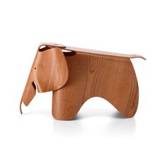 a wooden elephant figurine on a white background