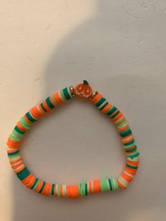 A cute little pumpkin bracelet with stretchy string and clay beads Fall Braclets Clay Bead, Pumpkin Clay Bracelet, Cheap Orange Halloween Bracelets, Beaded Pumpkin Bracelet, Bangle Bracelet Pumpkin, Clay Bracelet, Clay Beads, Jewelry Bracelets, Beaded Bracelets